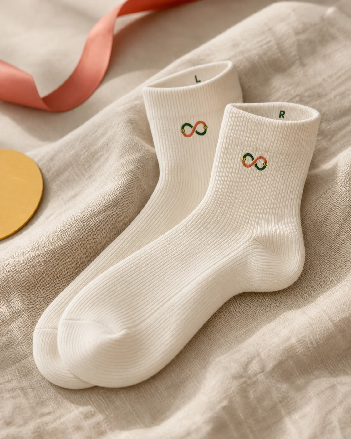 Premium white socks with the Twin Trace Pair Mark printed on the outer ankle